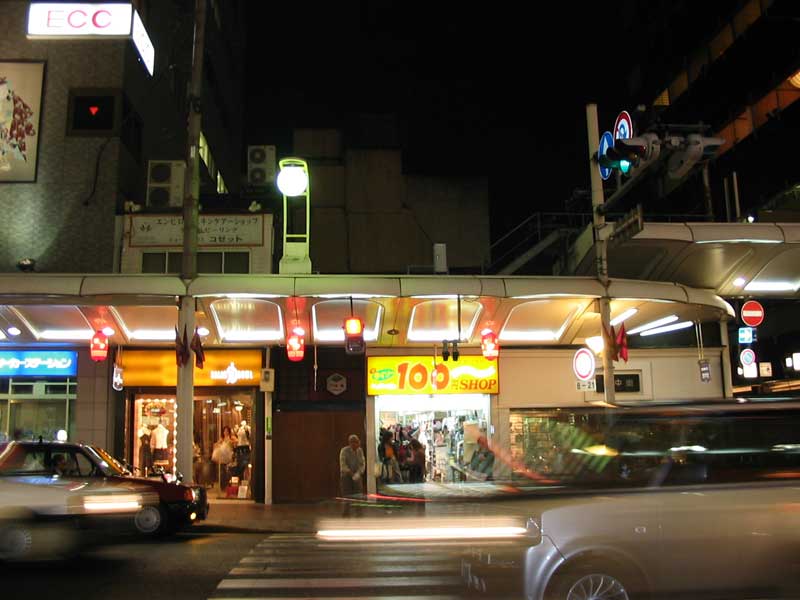 100 yen store yellow sign at night