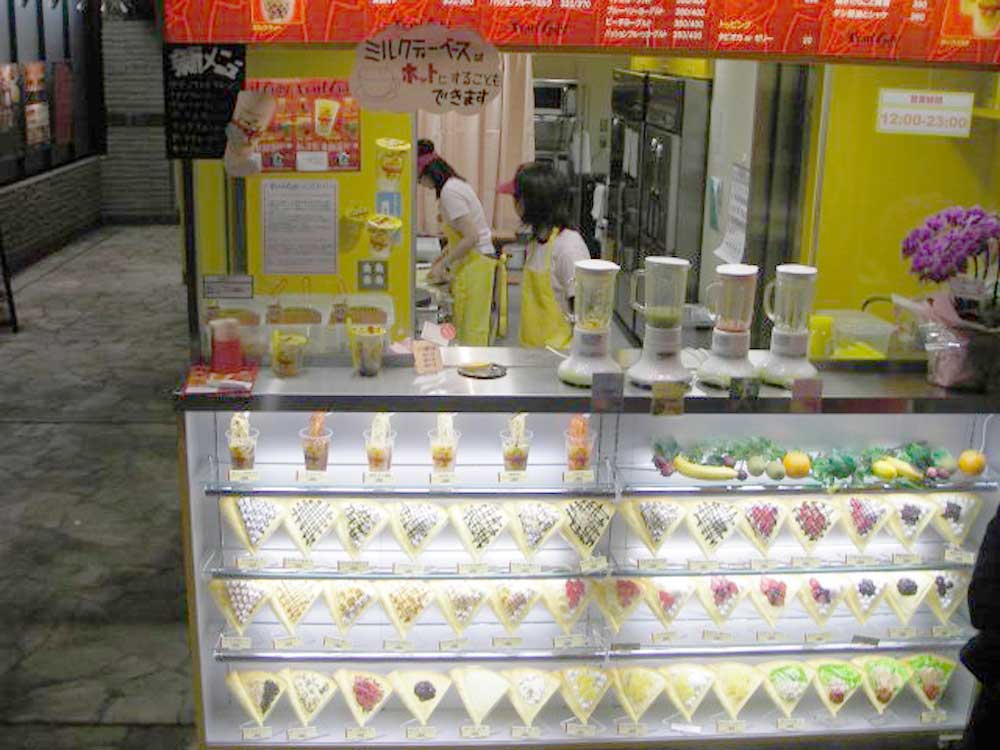 outdoor stand at night selling crepes