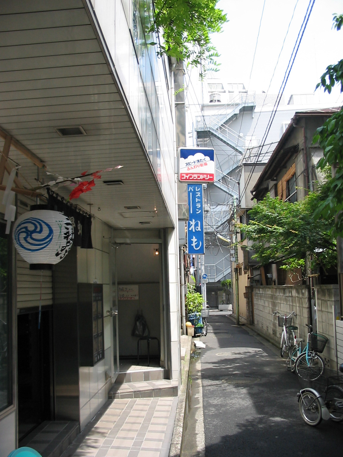 narrow street with sign with bubbles