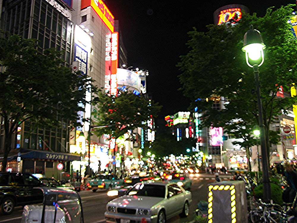 busy street at night with bright lights